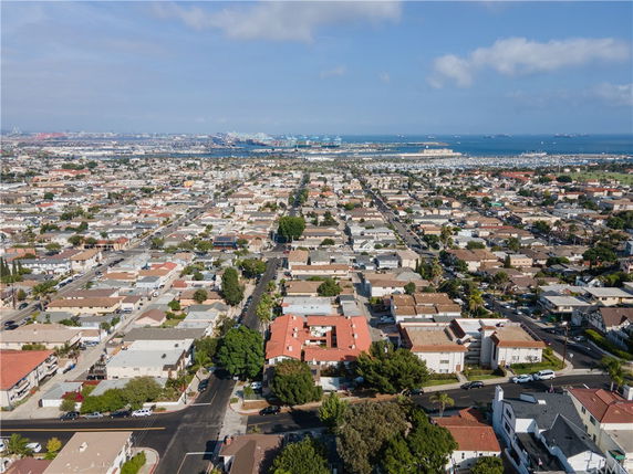 Panoramic view of a residential area with numerous houses and buildings.