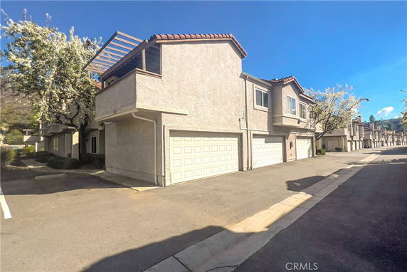 Front view of a two-story house with a double garage.