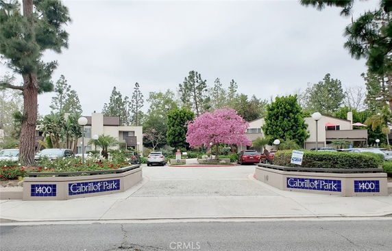 Front view of Cabrillo Park buildings with a pathway leading into the complex.