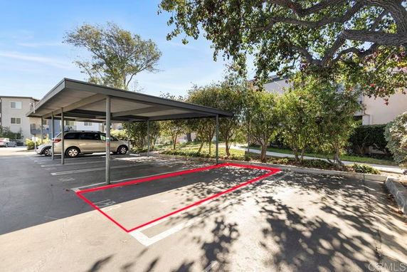 Outdoor parking area with a covered parking shade.