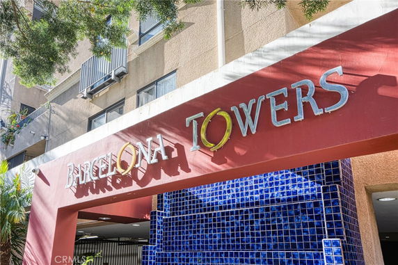 Front view of a building with signage reading 'Barcelona Towers'.