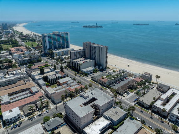 Aerial view of a coastal city with high-rise buildings and beach.