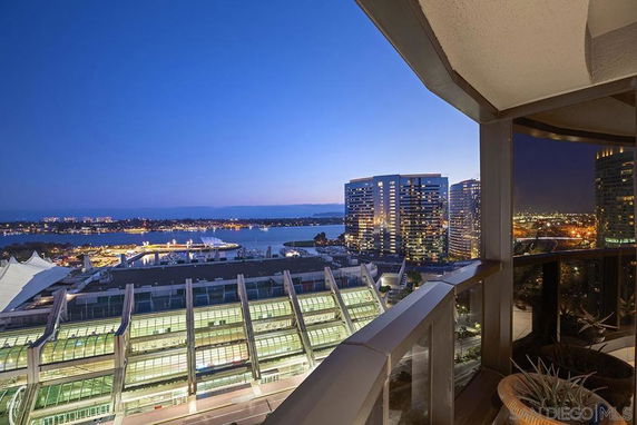 Panoramic view of city skyline and waterfront from a high-rise building.