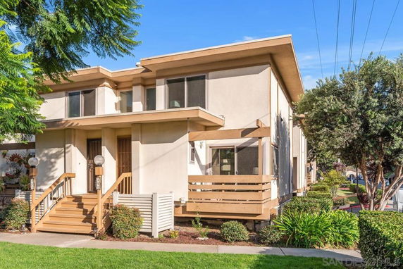 Front view of a two-story house with modern design and brown accents.