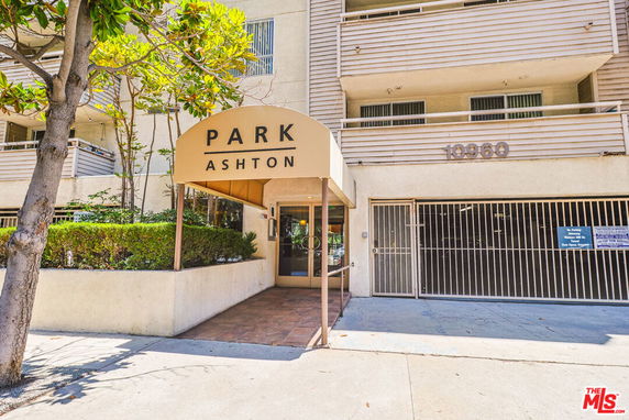 Front view of a multi-story building with a covered entrance labeled 'Park Ashton'.