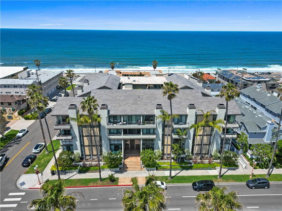 Front view of a multi-story oceanfront building.