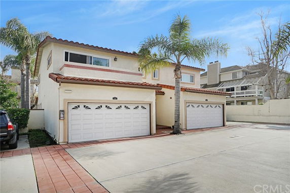 Front view of a two-story house with a double garage.