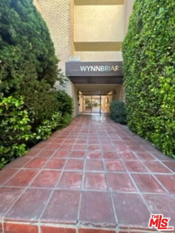 Entrance pathway to a multi-story building.