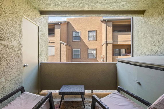View from a balcony looking towards adjacent buildings.