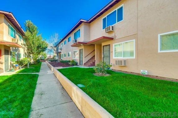 Front view of a two-story residential building with multiple units.