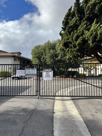 Front view of a gated residential building.