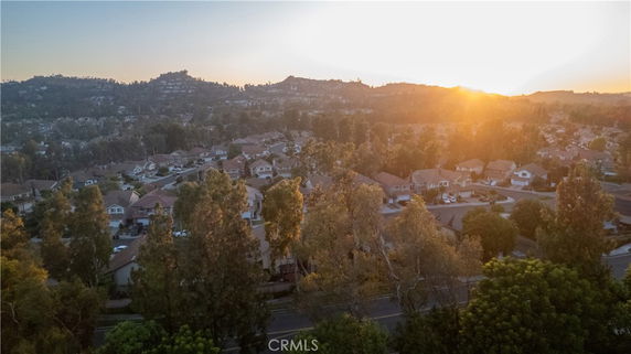 Wide angle view of a residential area with multiple houses at sunset.