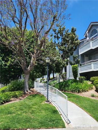 Front view of a multi-story residential building with balconies.