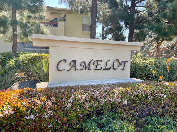 Front view of a building with a sign reading 'CAMELOT'.