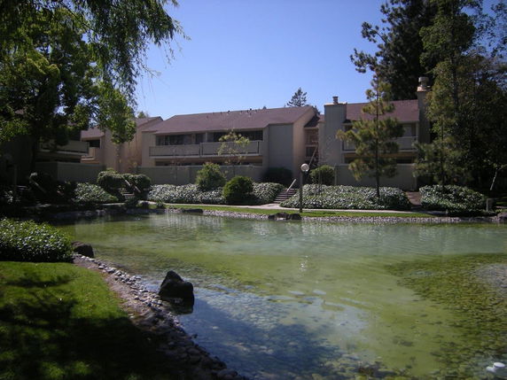 Front view of a residential building with balconies.