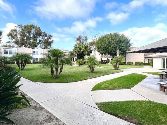 Garden courtyard view with buildings in the background.