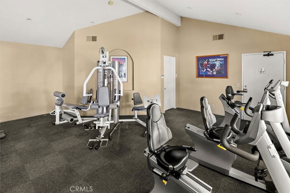 Indoor gym area with exercise equipment including stationary bikes and weight machines.