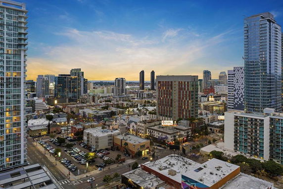 Panoramic view of a city skyline with numerous high-rise buildings.