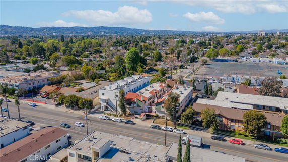 Wide aerial view of a suburban area with multiple buildings and streets.