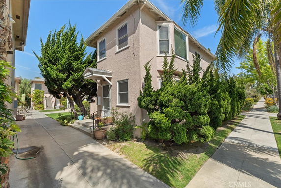 Front view of a two-story house with a small entrance porch.