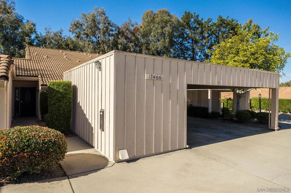 Front view of a house with attached covered parking area