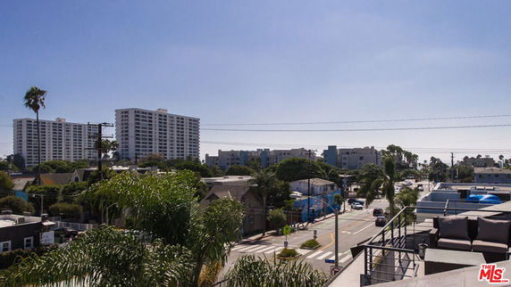 Panoramic view of a cityscape with buildings and streets.