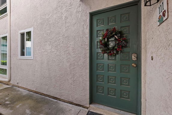Front door of a house with a decorative wreath