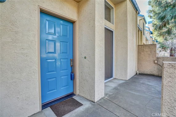 Front view of a building entrance with a blue door.