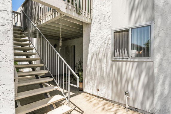 Exterior view of a building with an outdoor staircase.