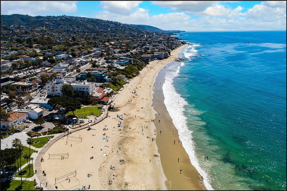 Panoramic view of a coastal city and beach.