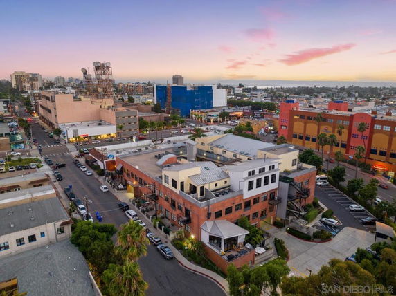 Aerial view of an urban area with multiple buildings and streets.