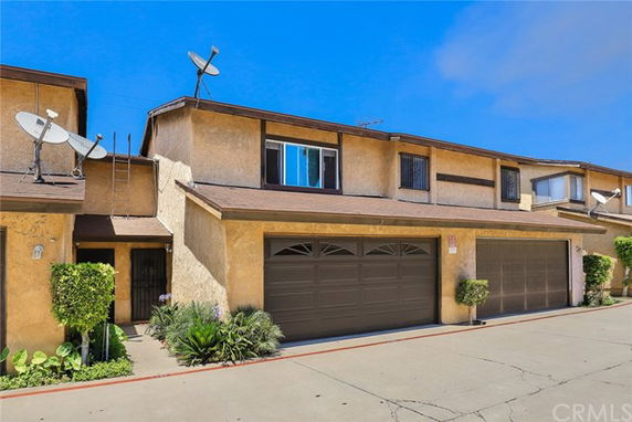 Front view of a two-story house with a double garage.