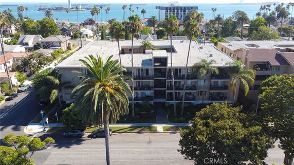 Aerial view of a multi-story residential building near the coast.