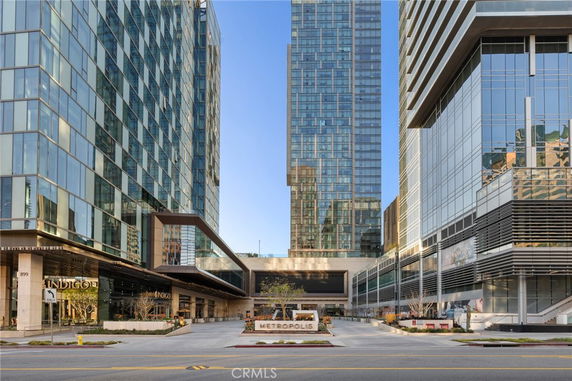 Front view of a modern high-rise building complex with glass facades.