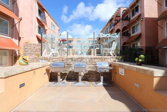Outdoor area with grills between residential buildings