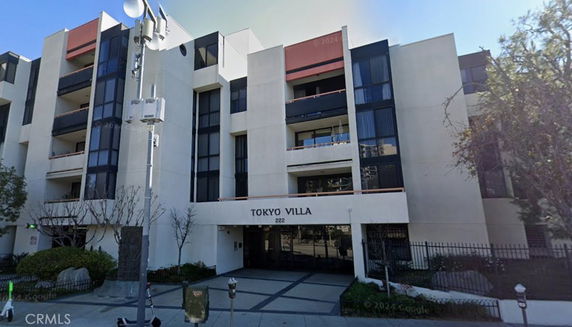 Front view of a multi-story building named Tokyo Villa.