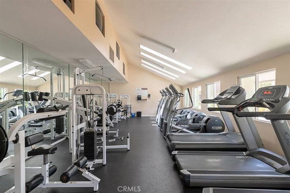 Indoor gym area with exercise equipment and treadmills.