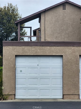 Front view of a house with a single garage.