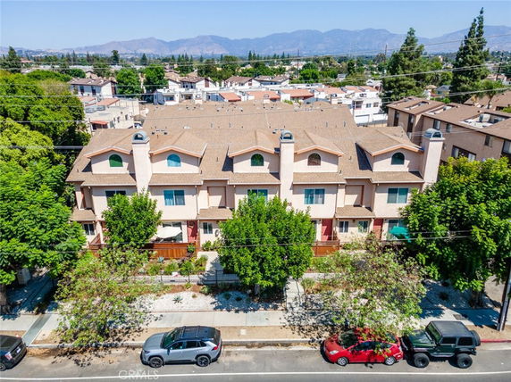 Front view of a multi-story residential building with a symmetrical facade.