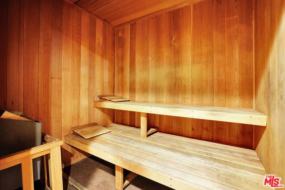 Wooden sauna interior with seating benches.