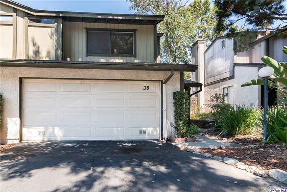 Front view of a two-story house with a double garage.