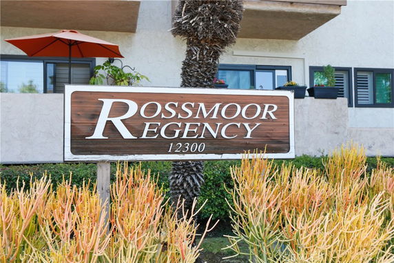 Front view of a residential building with a visible sign labeled 'Rossmoor Regency'.