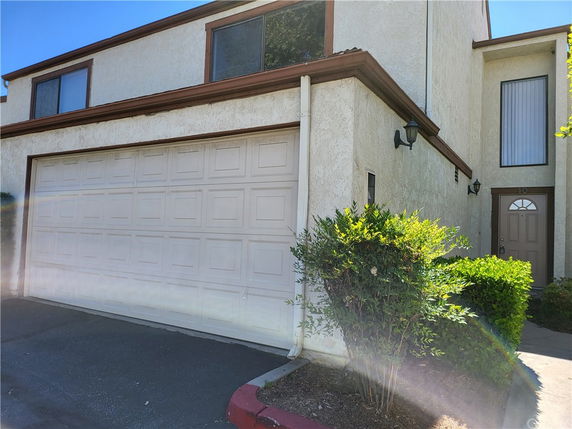 Front view of a two-story house with a double garage.