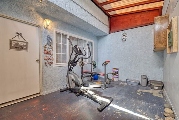 Small indoor gym area with exercise equipment.