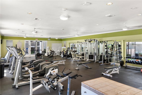 Interior view of a gym with exercise equipment and machines.