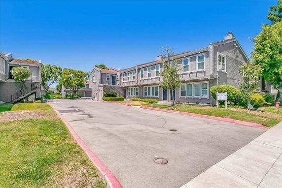 Front view of a two-story residential building with multiple units.