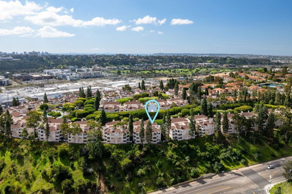 Panoramic view of a residential area with multiple buildings and greenery.