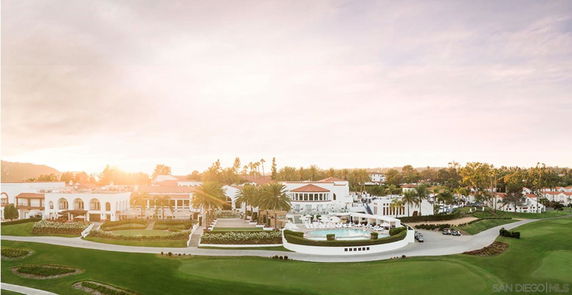 Panoramic view of a large estate with landscaped gardens and multiple buildings.