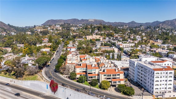 Wide angle view of a residential area with hills in the background.