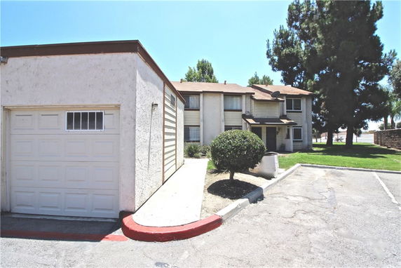 Front view of a two-story building with attached garage.